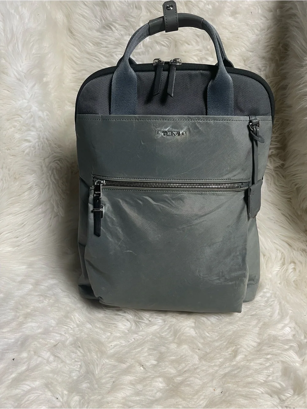 Tumi Voyageur Halsey nylon Gray Backpack with leather Top Handles.